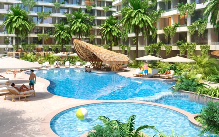 Layan Green Park — pool bar between buildings